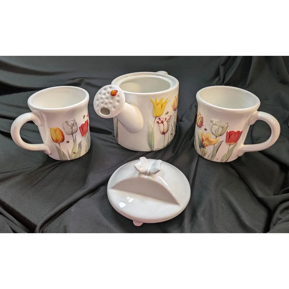 Teapot with two matching mugs